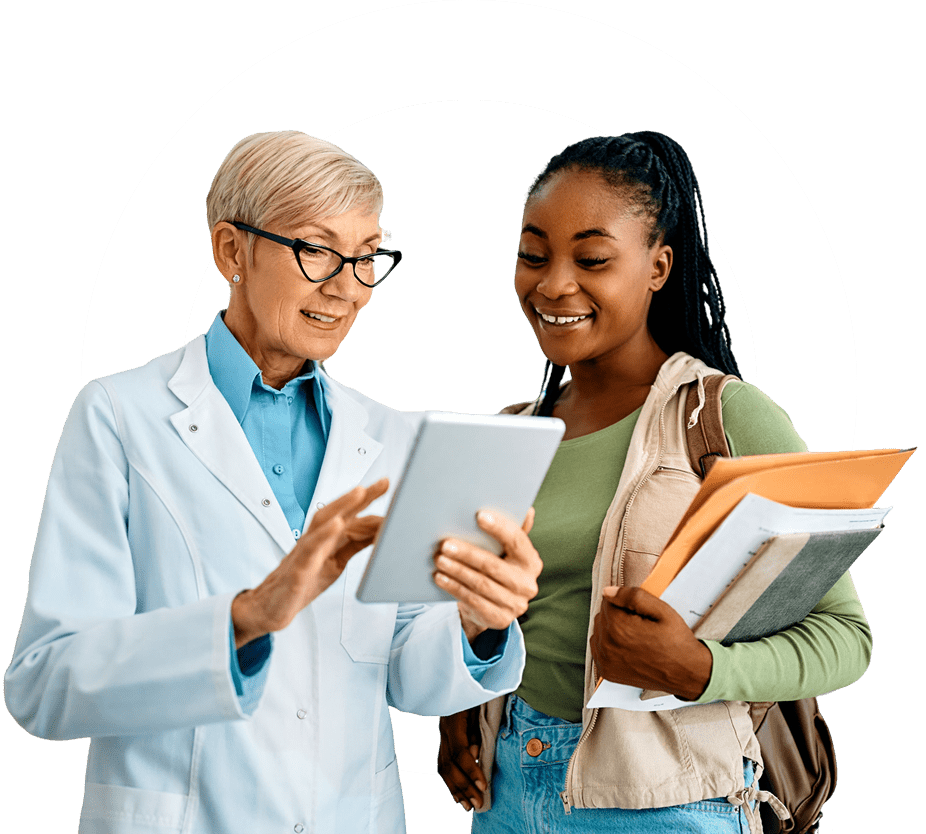 Doctor and student reviewing information on tablet.