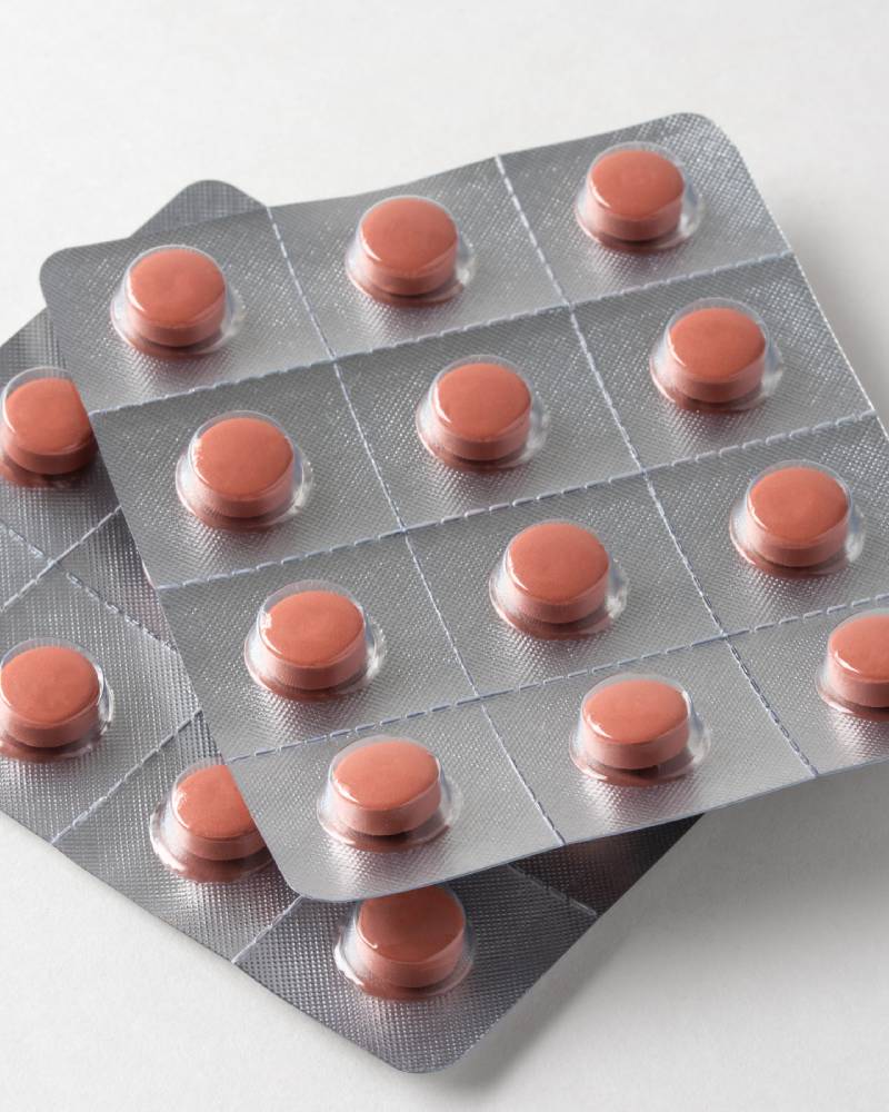 A close up of several pills in a pack
